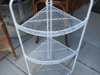 Corner metal shelf